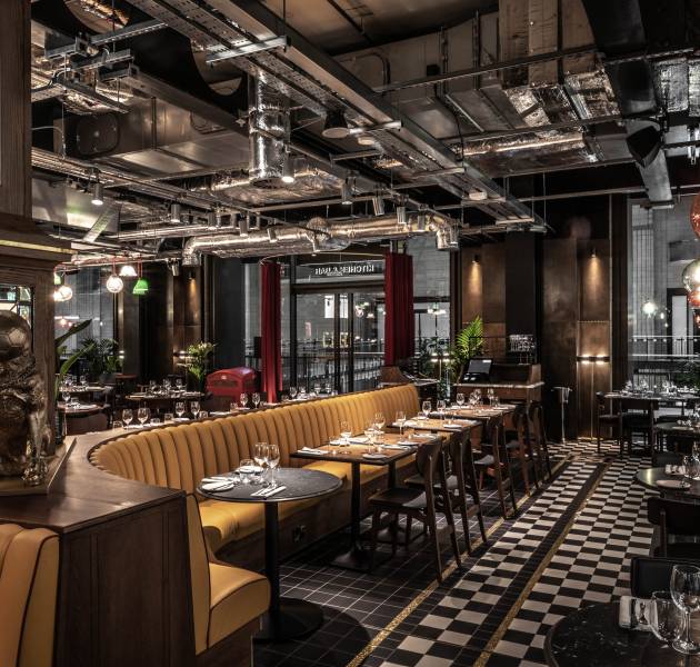 Guests enjoying dinner at Gordon Ramsay's Bread Street Kitchen Restaurants in Dubai