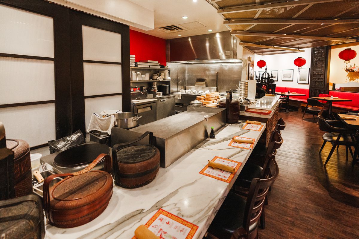 Chef preparing food at Royal China Restaurants in Dubai